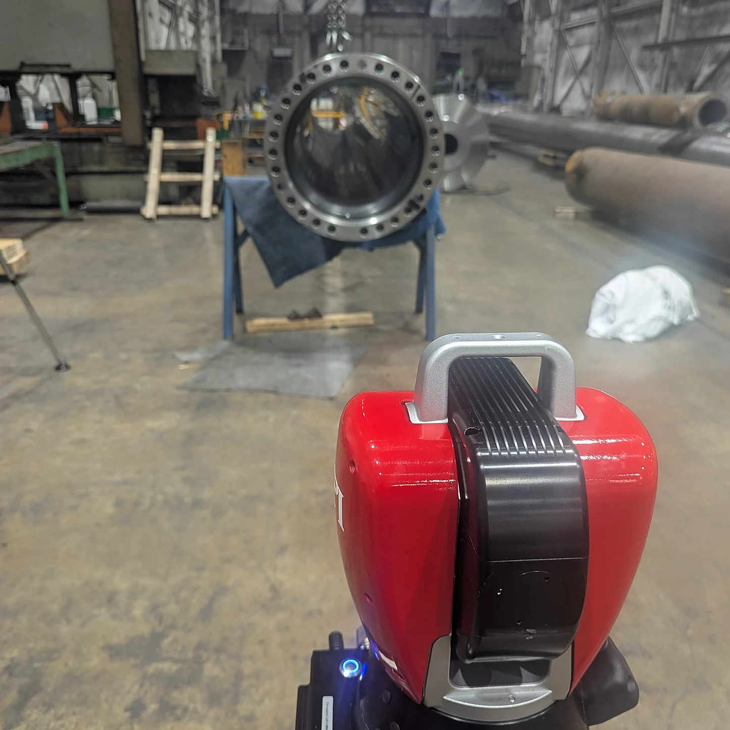 Laser tracker measuring a flanged component in the shop for virtual alignment before installation